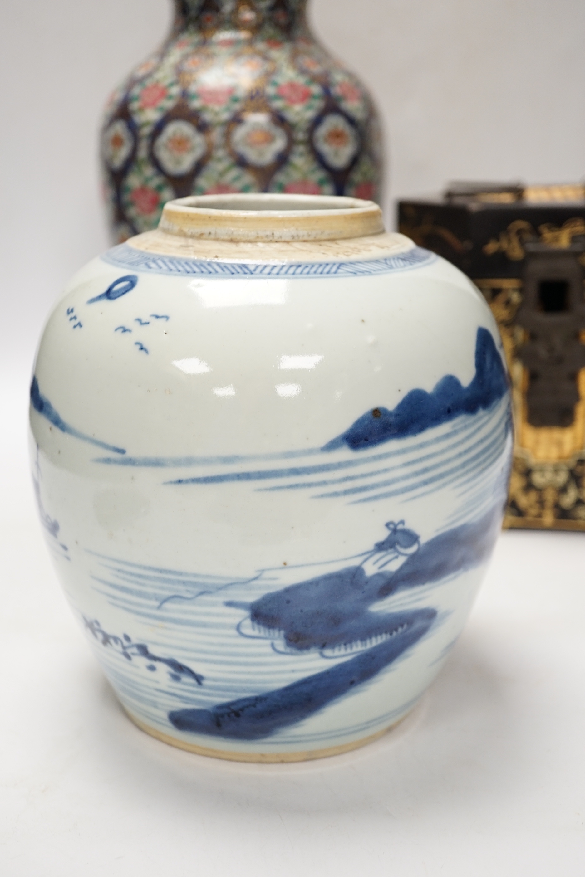 A group of Chinese items including a hardwood carving of luohan, an 18th century blue and white jar, a lacquer box, etc.